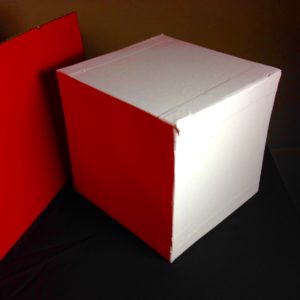 White Cube with Red Reflected Light. You may think the cube is white but it isn't white if a color is reflecting on it.