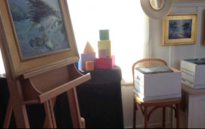 Studio with easel and color blocks at window